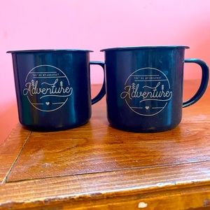 Two black metal coffee mugs.